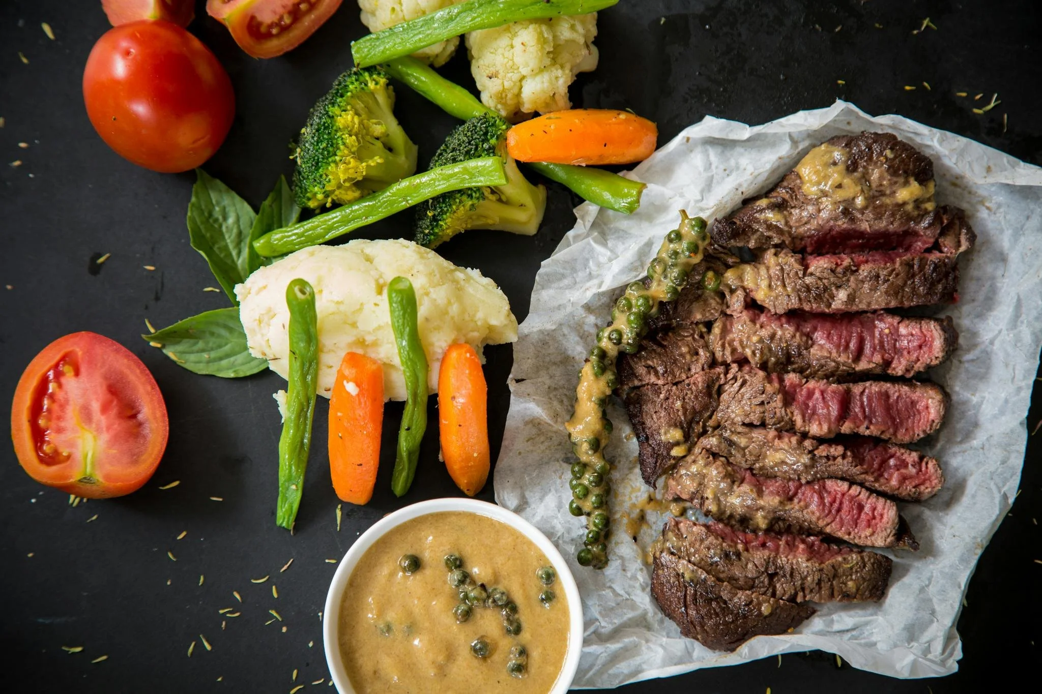 Plated steak with vegetables